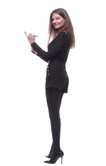 Fototapeta premium side view. young woman writing something to the clipboard.