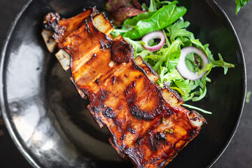 ribs meat bbq pork fried beef or lamb sauce hot spices meal snack copy space food background rustic top view