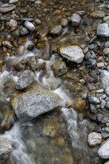Fototapeta na wymiar cristall clear water of mountain creek Calnègia in Valle Bavona, Ticino