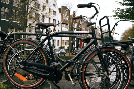 Photo of a bicycle in Amsterdam, Netherlands. Transport in big cities, cyclists.