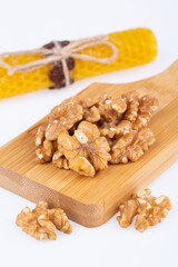 walnut butterfly, on a wooden board, halves, on a white background