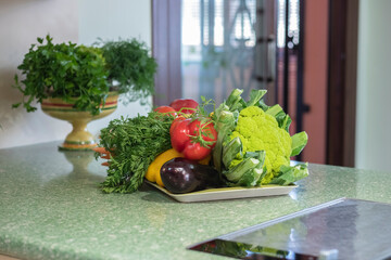 vegetables near to sink in a modern kitchen