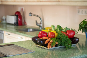 vegetables near to sink in a modern kitchen