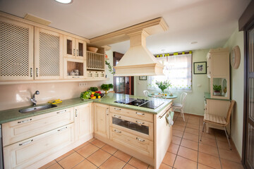 Modern kitchen interior with red walls and white furniture