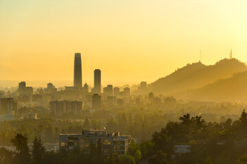 Fototapeta premium A silhouetted panoramic view of Santiago de Chile at sunset.