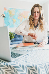 Travel agent working with documents at office.