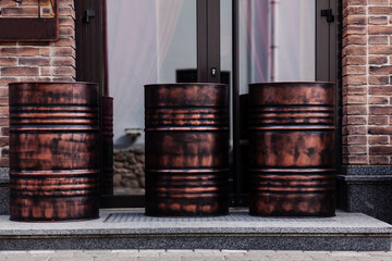 metal barrels near the cafe