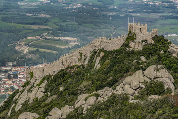 Fototapeta na wymiar Castle of the Moors (Castelo dos Mouros) - hilltop medieval castle located in municipality of Sintra, about 25km northwest of Lisbon. Moors Castle built by Moors in 8th - 9th centuries. Portugal.