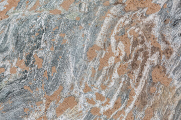 Beautiful stone surface with sand in the hollows.