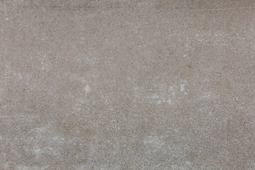 Beige concrete background in close up.