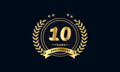 10th golden anniversary logo, with shiny ring and golden ribbon, laurel wreath isolated on navy blue background - obrazy, fototapety, plakaty