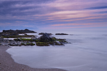 Fototapeta na wymiar Long exposure marine scene in pastel tones