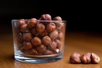 Hazelnuts in a clear glass on a table