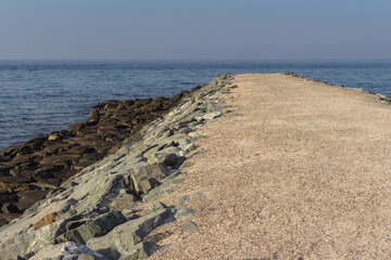 A pebble road in the middle of a rocky seashore