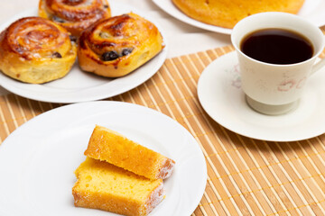Coffee table with orange cake, apple donut and sugar. Top View.