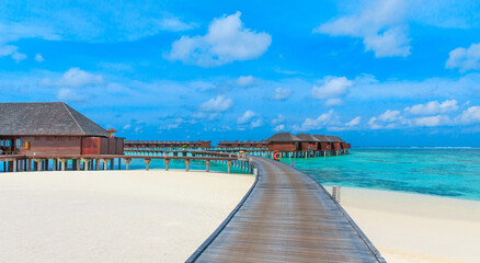  beach with water bungalows at Maldives.