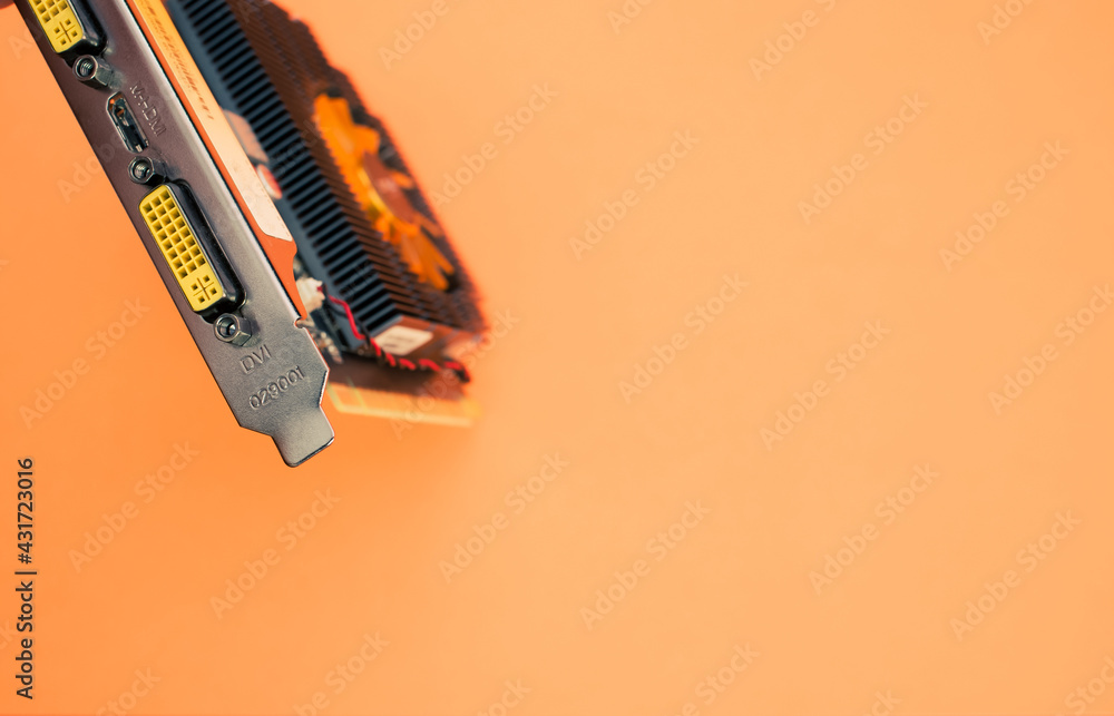 Poster closeup shot of a computer graphics card on an orange background