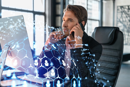 Businessman in suit has conference call to hire new employees for international business consulting. HR, social media hologram icons and interconnections over office background with panoramic windows
