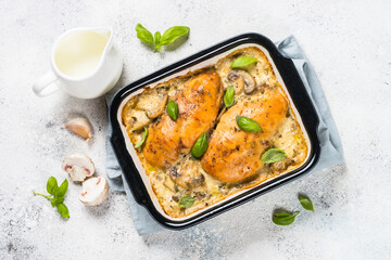 Baked chicken breast with mushrooms in cream sauce.