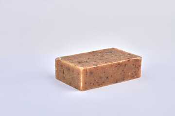 Brick of handmade soap on white background.