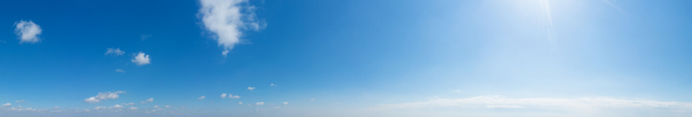 Blue Sky background with tiny Clouds. Panorama background