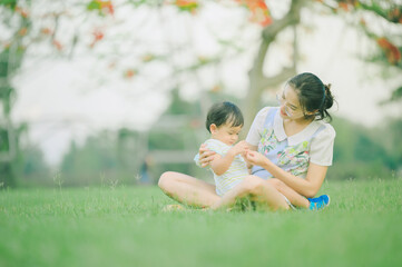 Mother And Baby outdoors. Nature.Portrait of happy loving mother