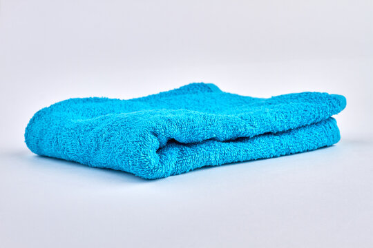Blue sowt towel isolated on white background.