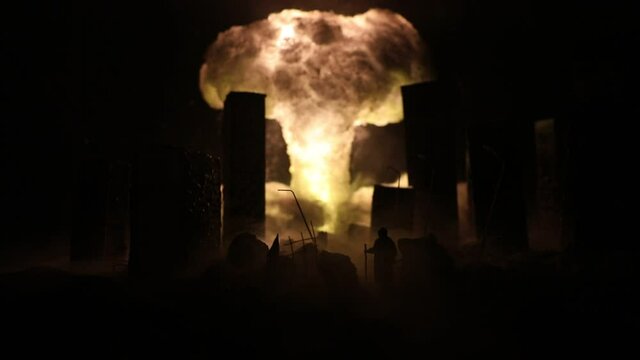 Nuclear war concept. Explosion of nuclear bomb. Apocalyptic view of city downtown after bombing. Night scene. City destroyed by war.