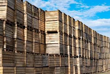 many wooden crates on blue sky background