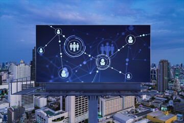 Fototapeta premium Glowing Social media icons on billboard over night panoramic city view of Bangkok. The concept of networking and establishing new connections between people and businesses in Southeast Asia