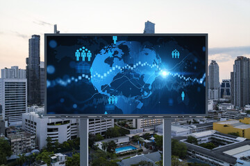 World planet Earth map hologram of social media icons over sunset panoramic cityscape of Bangkok, Southeast Asia. The concept of people connections.