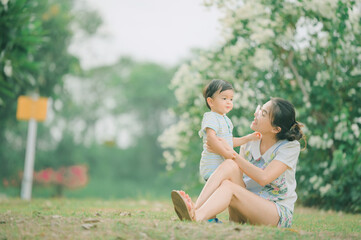 Fototapeta premium Mother And Baby outdoors. Nature.Portrait of happy loving mother