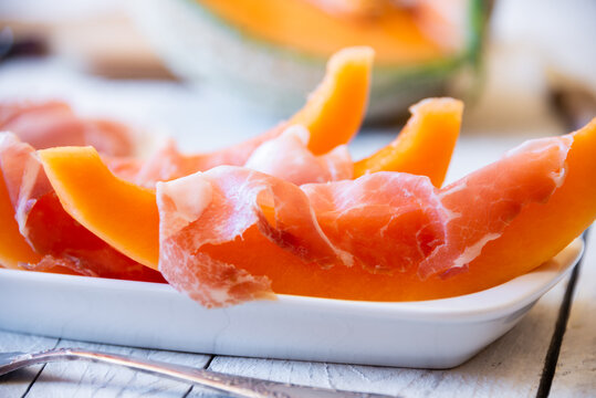 Fresh sweet melon with prosciutto ham, healthy summer food