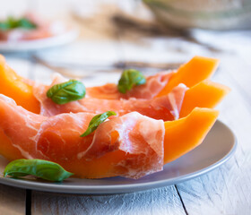 Fresh sweet melon with prosciutto ham, healthy summer food