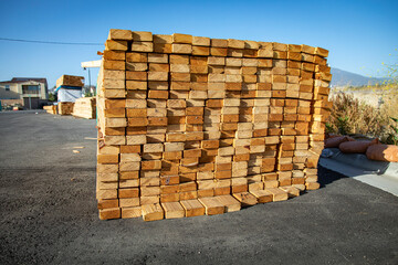 Lumber stacked at a housing construction site