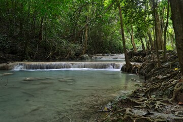 beautiful waterfalls of turquoise water in the middle of the jungle in thailand