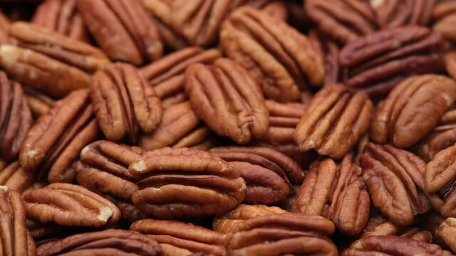 raw pecan nuts close up. Healthy food concept. 4K UHD video