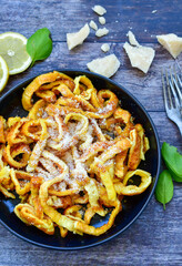 Italian diet ketogenic  food . Fresh home made egg  tagliatelle vegetarian  egg pasta  with parmesan cheese lemons and black pepper. Ketogenic egg fast