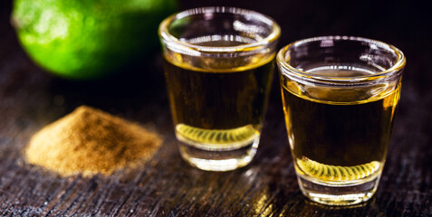 Mezcal glasses, tequila variation with pepper salt and earthworm, traditional Mexican drink and...