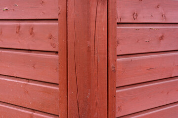 textura of red boards - corner of the garden gazebo, wooden background