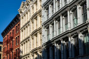 Fototapeta premium Typical building facades in SoHo, the Cast Iron Historic District with distinct late 19th centtury architecture. Manhattan, New York City, USA