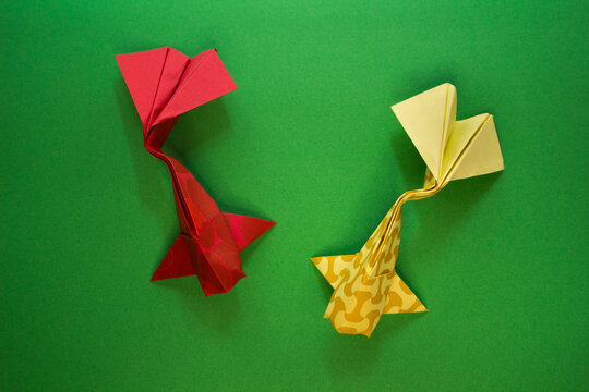 origami koi fish on a green background