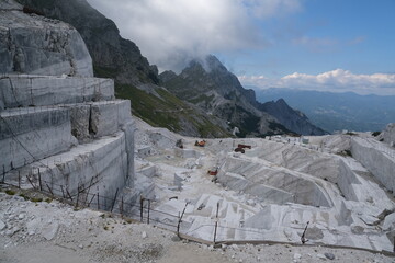 White marble quarries on the Apuan Alps in Tuscany.Quarries near the Passo della Focolaccia with stepped mountain cut.  Alpi Apuane, near Carrara, Italy. 