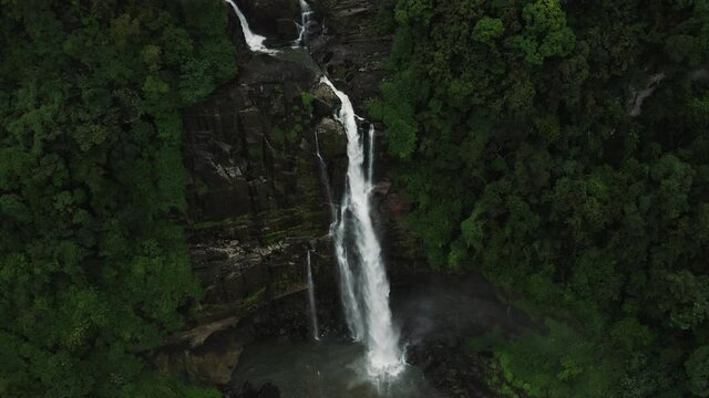 Beautiful Aberdeen Waterfall in middle of green jungle of Sri Lanka, aerial