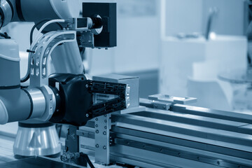 The hi-technology  material handling process by robotic system. The automatic pneumatic robotic arm picking the container box in production line.
