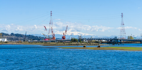 Seaport Cranes And Mountain