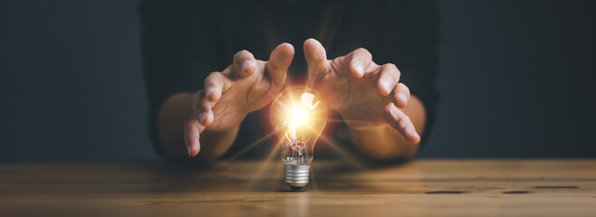 businessman protect light bulb, Creative new idea. Innovation, brainstorming, inspiration and...
