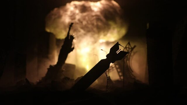 Nuclear war concept. Explosion of nuclear bomb. Apocalyptic view of city downtown after bombing. Night scene. City destroyed by war.
