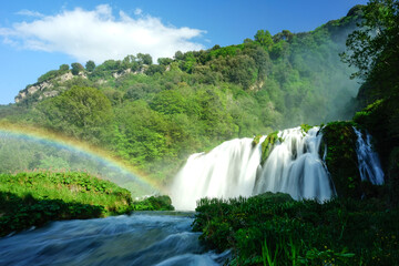 Marmore waterfall and Nera River with rainbow on a clear sky sprin day, Valnerina, Terni, Umbria, Italy