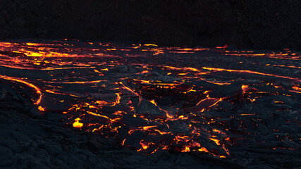 Breathtaking view of glowing lava flow at eruption site of volcano in Geldingadalir valley near Fagradalsfjall mountain, Grindavík, Reykjanes peninsula, southwest Iceland in the dark. © Timon